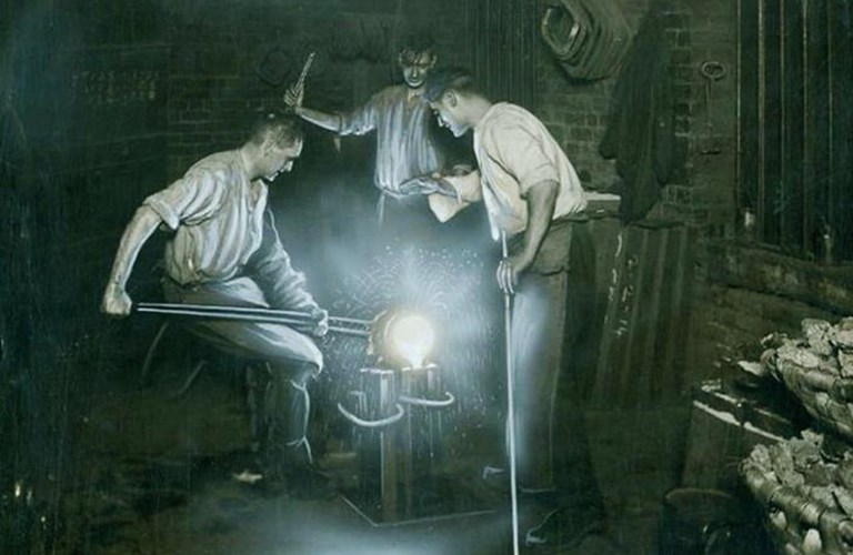 A historic black and white image three men pouring molten steel 