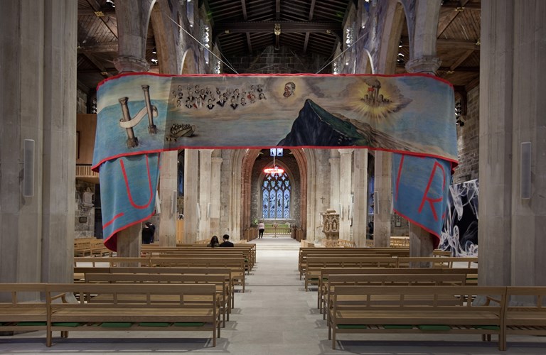 A painted banner across the nave of Sheffield Cathedral