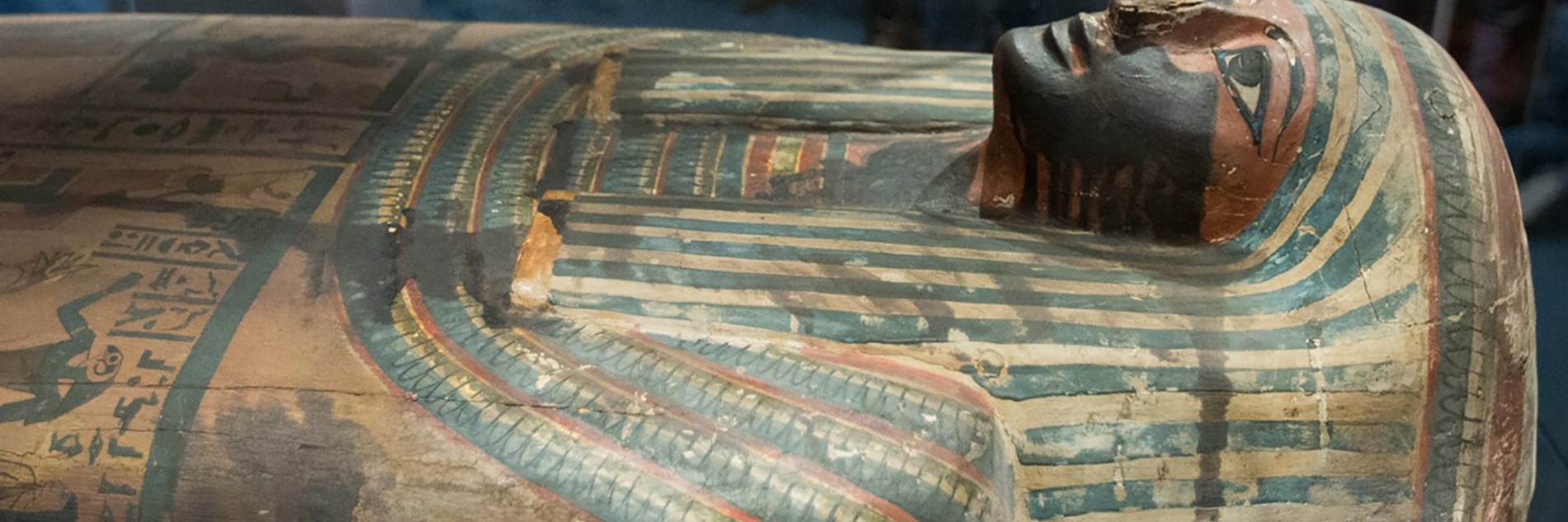 The top half of a painted Egyptian sarcophagi.