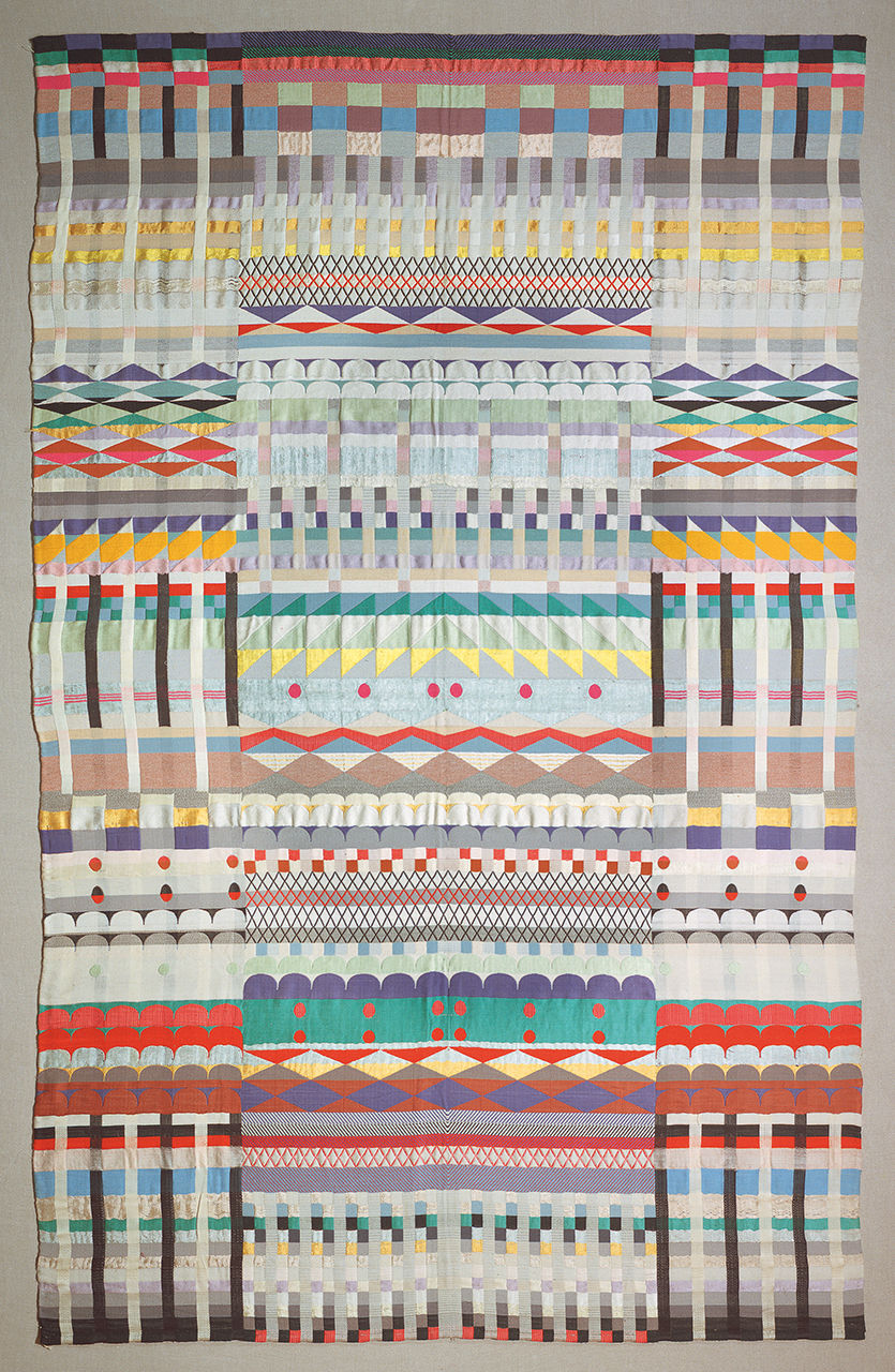 A multicoloured weaving comprising a range of different repeating geometric shapes in bright colours.