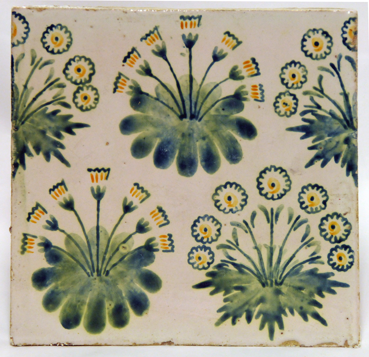 A circular repeating flower pattern with two variations. The stems are green and the flowers are yellow and white.