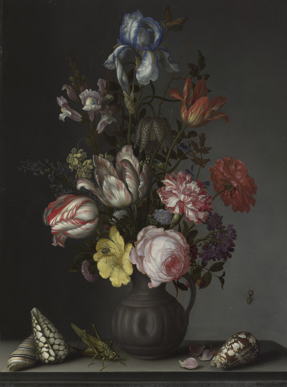 An arrangement of white, pink, red, blue, purple and yellow flowers in a grey jug against a dark background. Next to the jug are three shells, a large crickets and some dropped petals. 