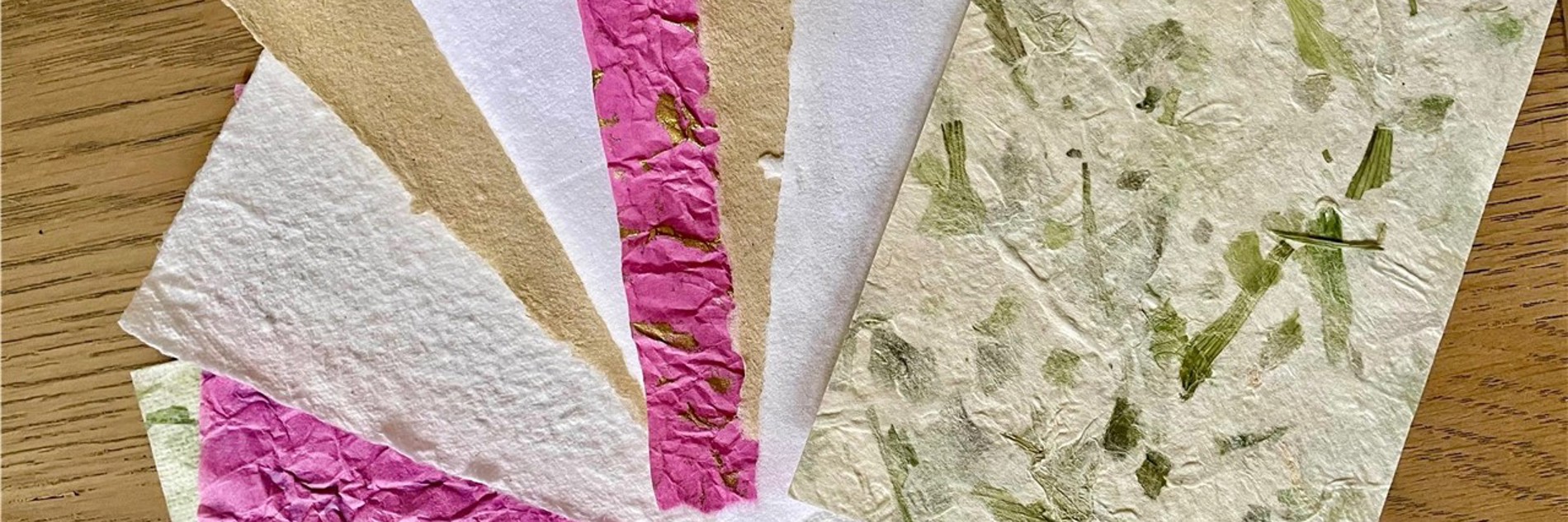 A photograph of handmade paper on a table. 