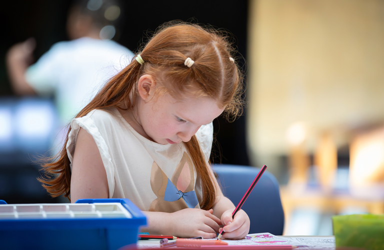 A child taking part in craft activities.
