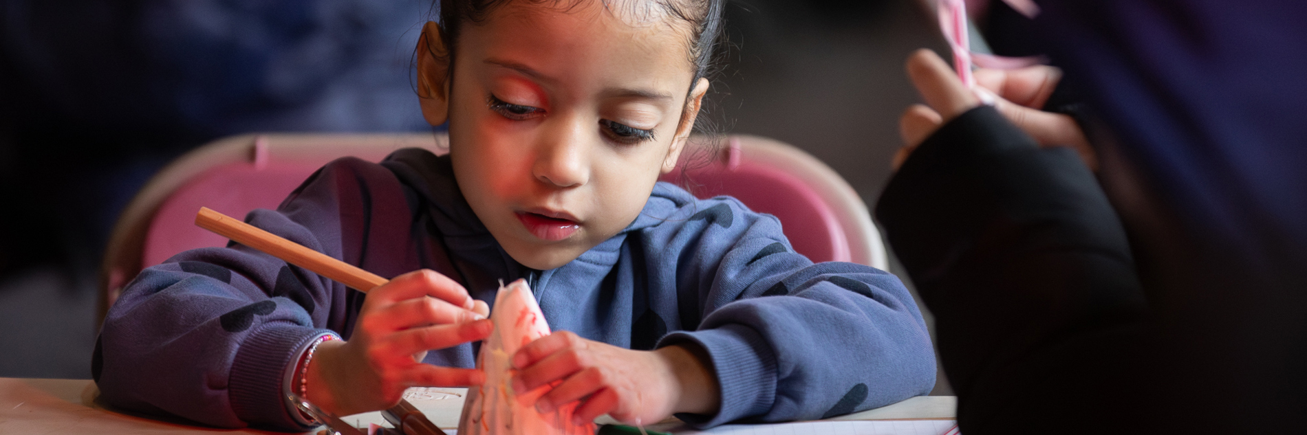 A child taking part in craft activities.