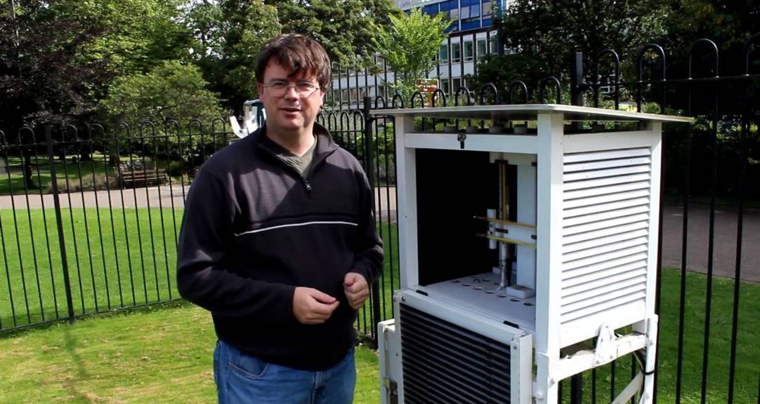 An adult outside in Weston Park, next to the Weather Station