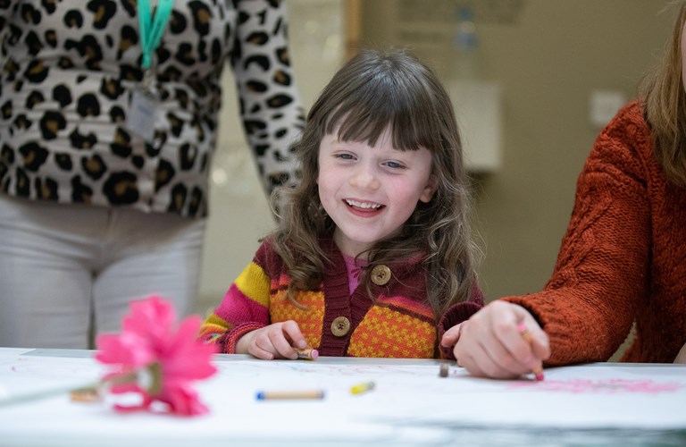 A child taking part in a craft activity.