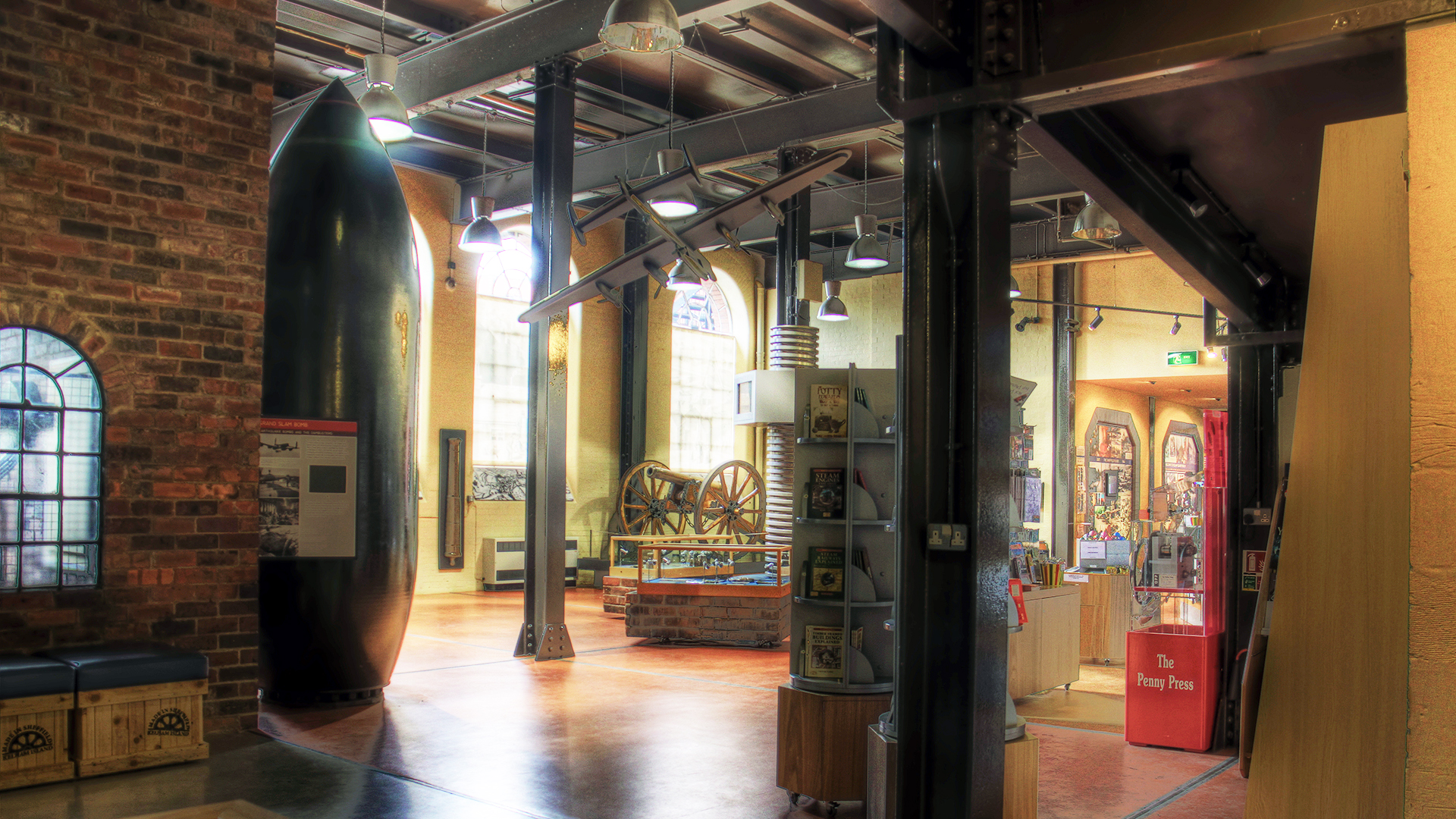 A very large bomb standing vertically on display in the Museum entrance hall.