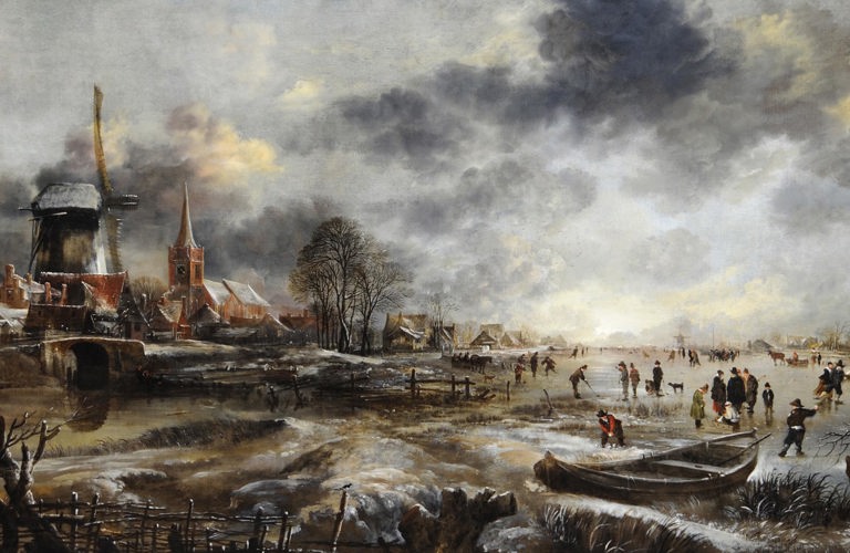 Aert van der Neer's painting Frozen River Scene. A large scale painting showing a community working around a frozen river. To the right of the image, we see a windmill, a church spire, and several residential buildings. The river sits in front of them, stretching across the entire foreground of the image. To the right of the frame, there is a boat pulled up on the bank, and lots of people playing on the ice. Some are ice skating, some seem to be using hockey sticks. Dark grey clouds fill the top of the frame, with patches of blue sky shining through. At the bottom of the image, and in the foreground, a row of chopped down trees and a wooden fence are depicted.