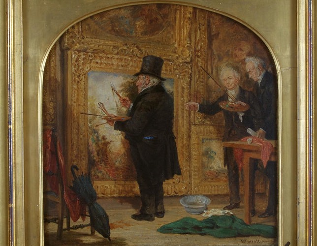 A photograph of a Turner painting displayed in a golden frame. The painting shows an older man in smart dress standing in front of a large canvas. He holds a variety of paintbrushes as two similarly dressed me look on, seemingly instructing him. There is an umbrella propped up in the foreground and a large green cloth discarded on the floor. 