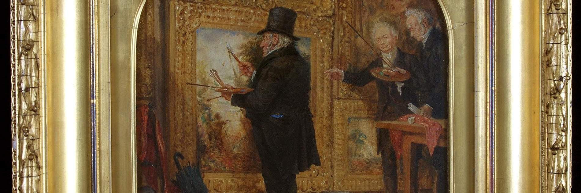 A photograph of a Turner painting displayed in a golden frame. The painting shows an older man in smart dress standing in front of a large canvas. He holds a variety of paintbrushes as two similarly dressed me look on, seemingly instructing him. There is an umbrella propped up in the foreground and a large green cloth discarded on the floor. 