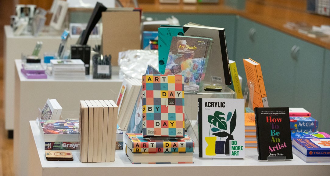 A museum shop display of art books and stationery items