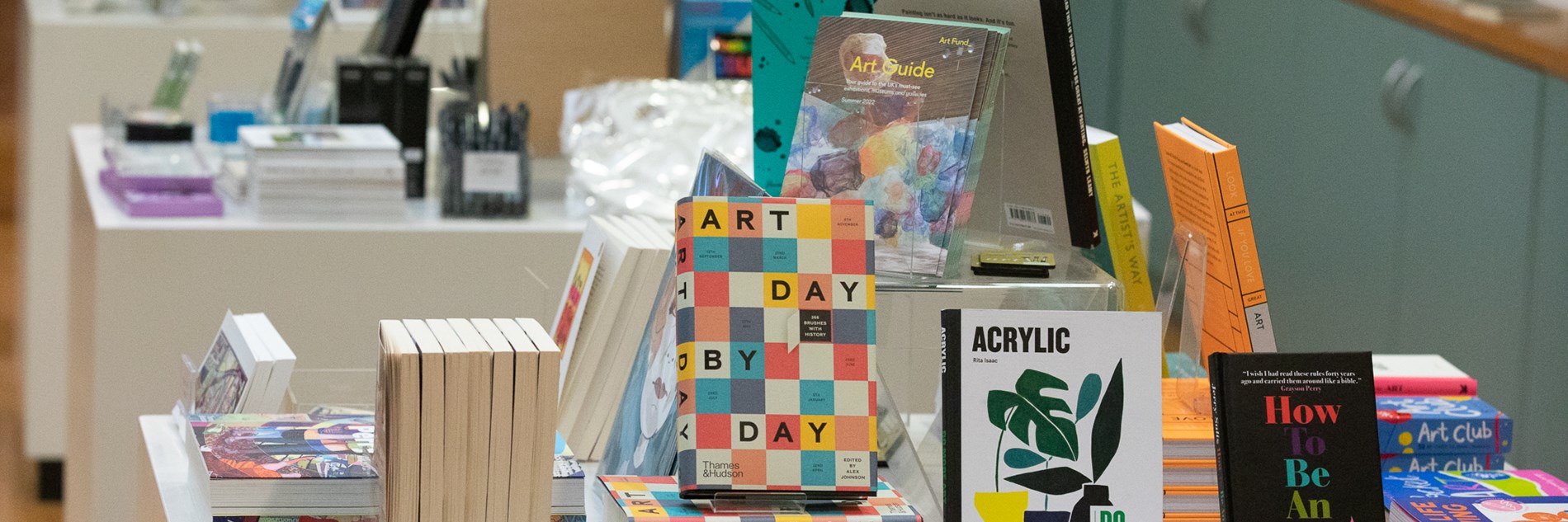 A museum shop display of art books and stationery items