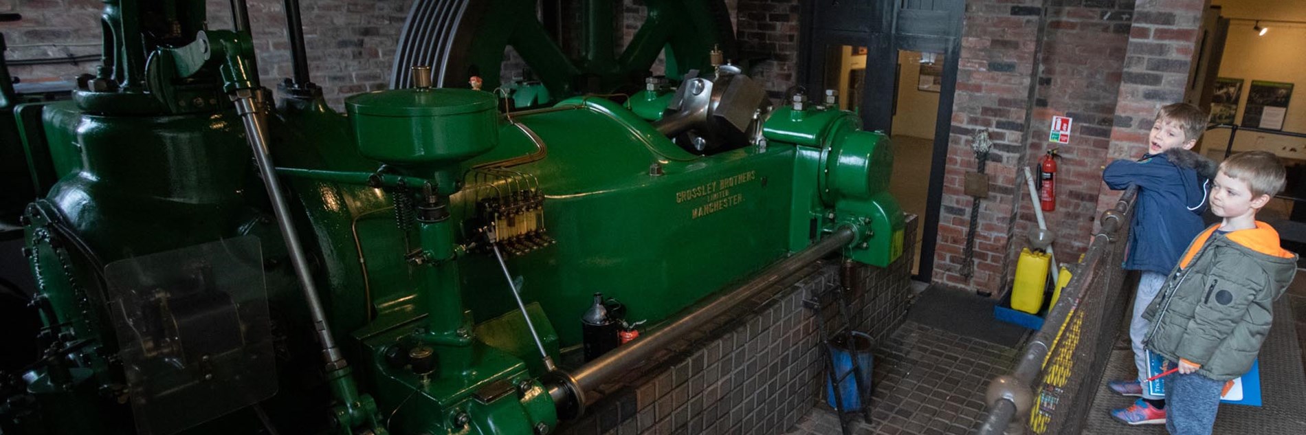 A restored working gas engine painted bright green 