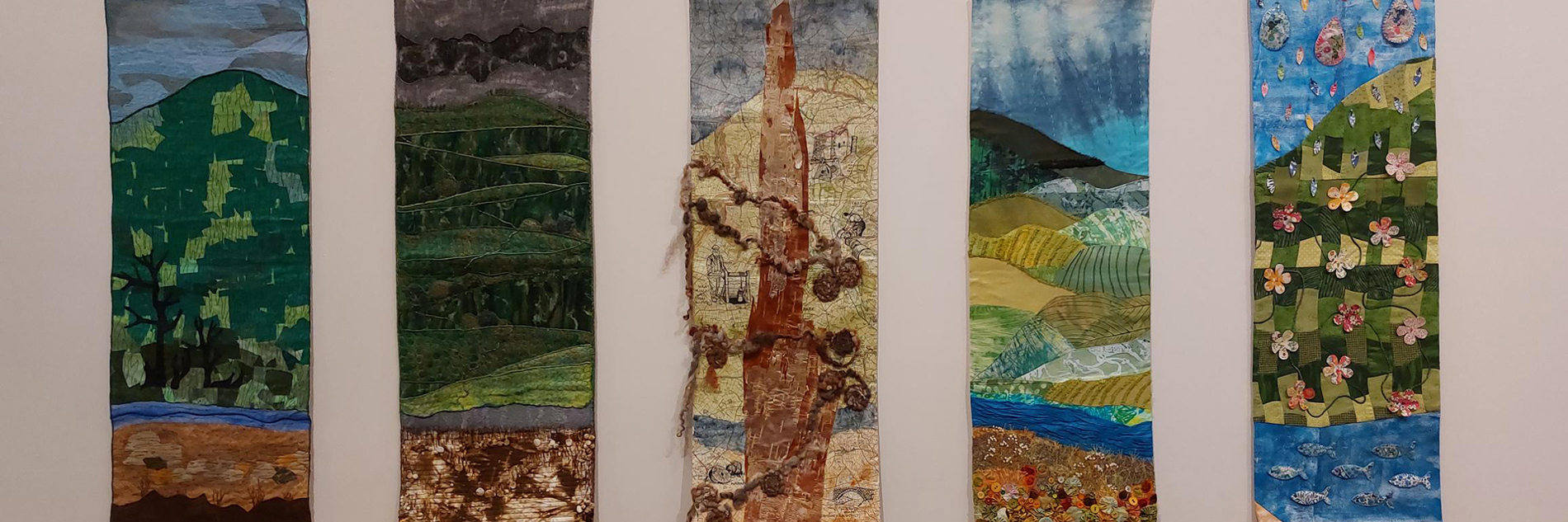 A photograph of 5 textile banners 