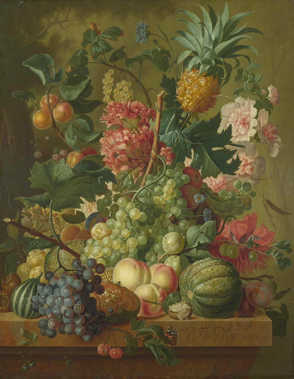 An arrangement of pink, red and blue flowers, green berries, black and green grapes, nectarines and other fruits on a shelf or mantle.