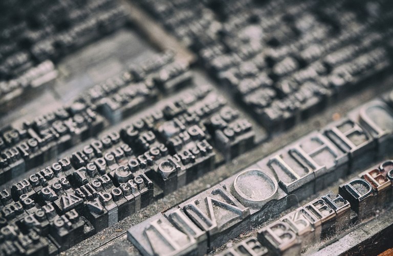 Photograph of metal type printing press lettering 