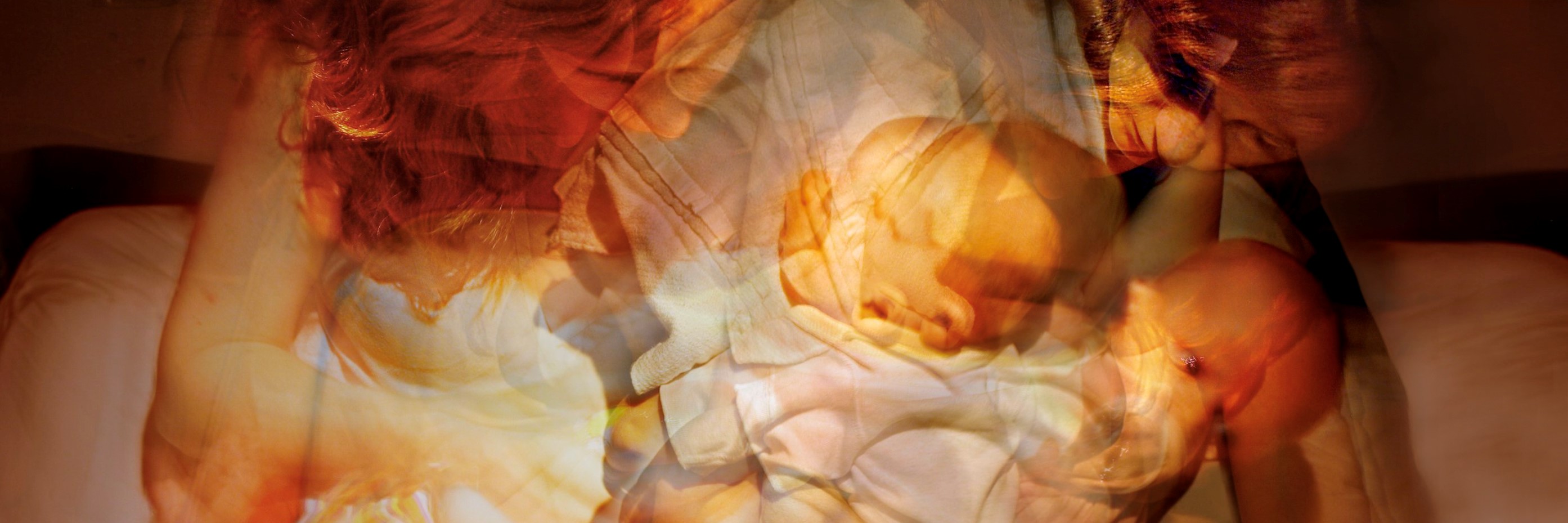 A photograph composed of multiple exposures of a mother and baby.
