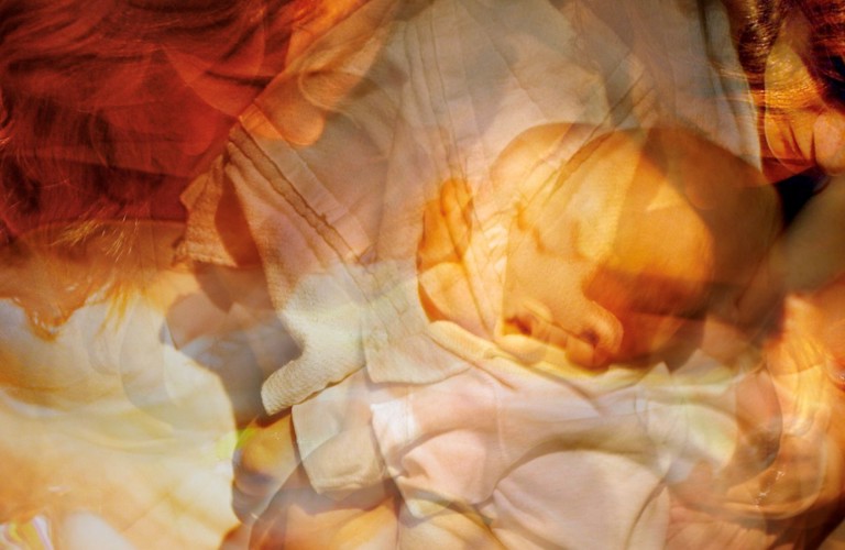 A photograph composed of multiple exposures of a mother and baby.