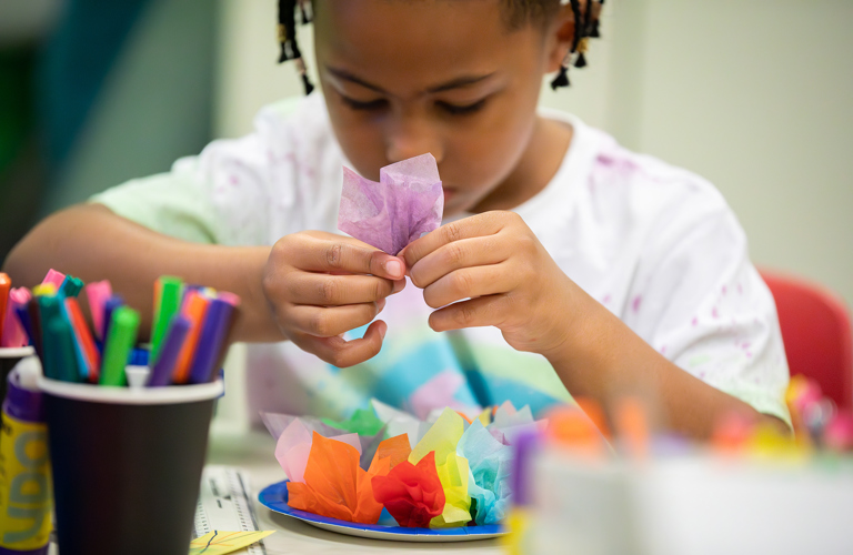 A child taking part in craft activities.
