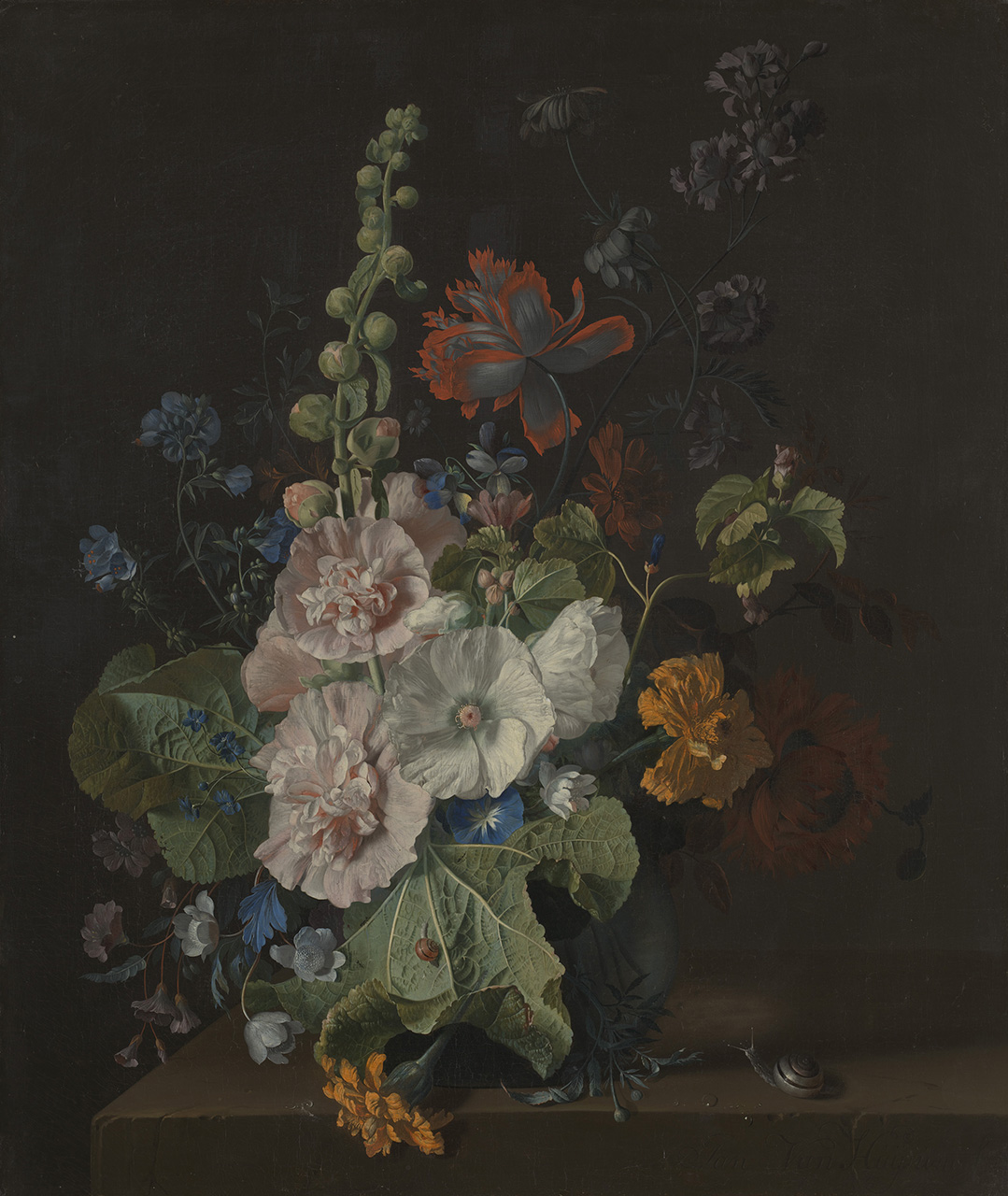 An arrangement of white, pink, blue, red and yellow flowers against a dark background.
