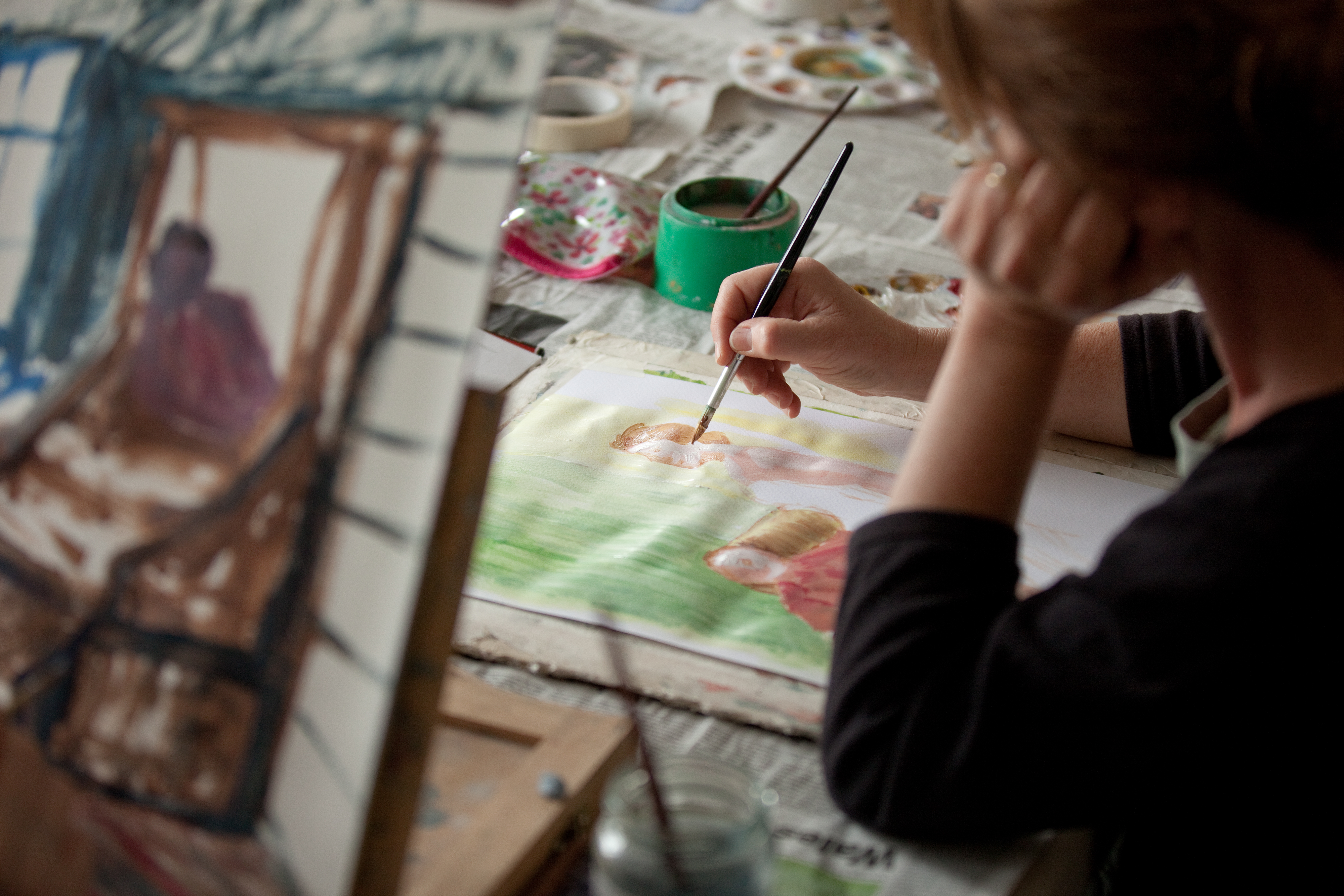 An image of someone doing a watercolour painting. 