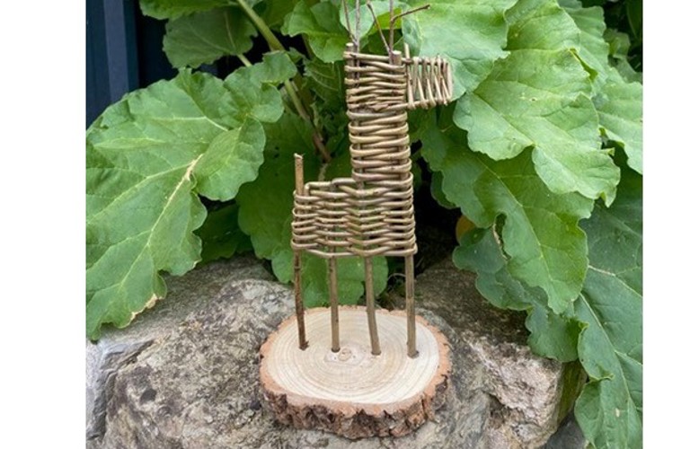 A composite image of various willow makes. On the left, there are green willow Christmas trees, stood on a log slice. On the right, there is a small willow deer.